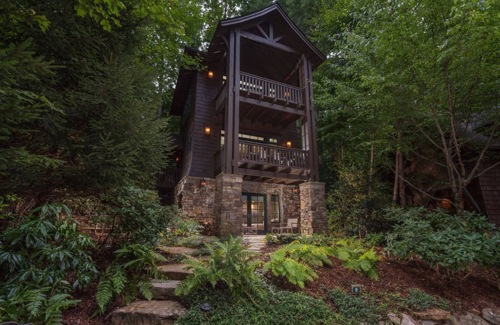 exterior photo of two story tiny luxury cabin in the woods  Greybeard Vacation Rentals