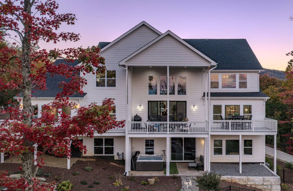 three story home with glorious sunset in the background Greybeard Vacation Rentals