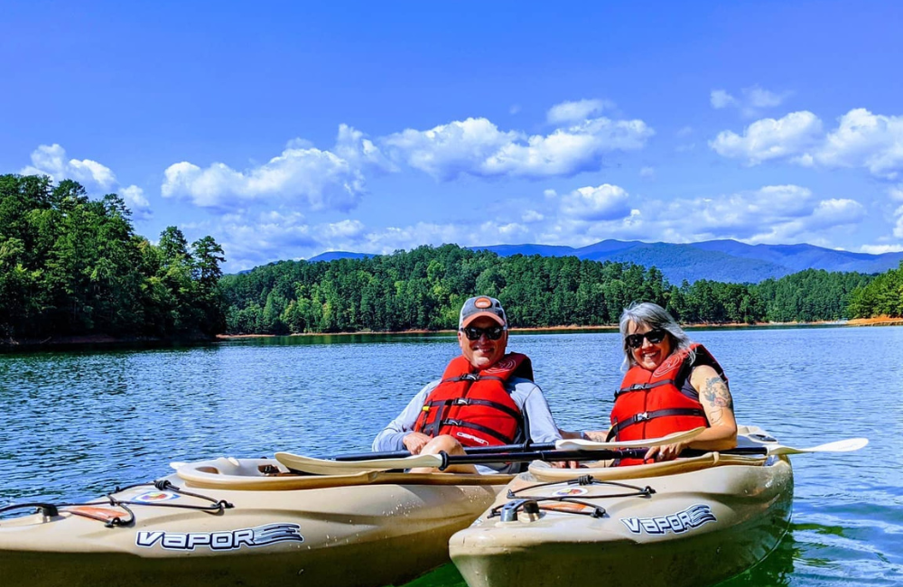 A couple kayaking on a WNC lake