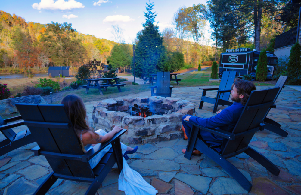 Asheville River Cabins wedded couple at firepit