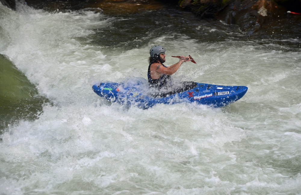 Completing the rapids while kayaking the Nantahala