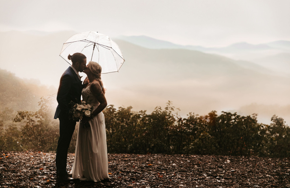 Kissing couple with amazing view at Outland Great Smoky Mountains Chalet & Suites