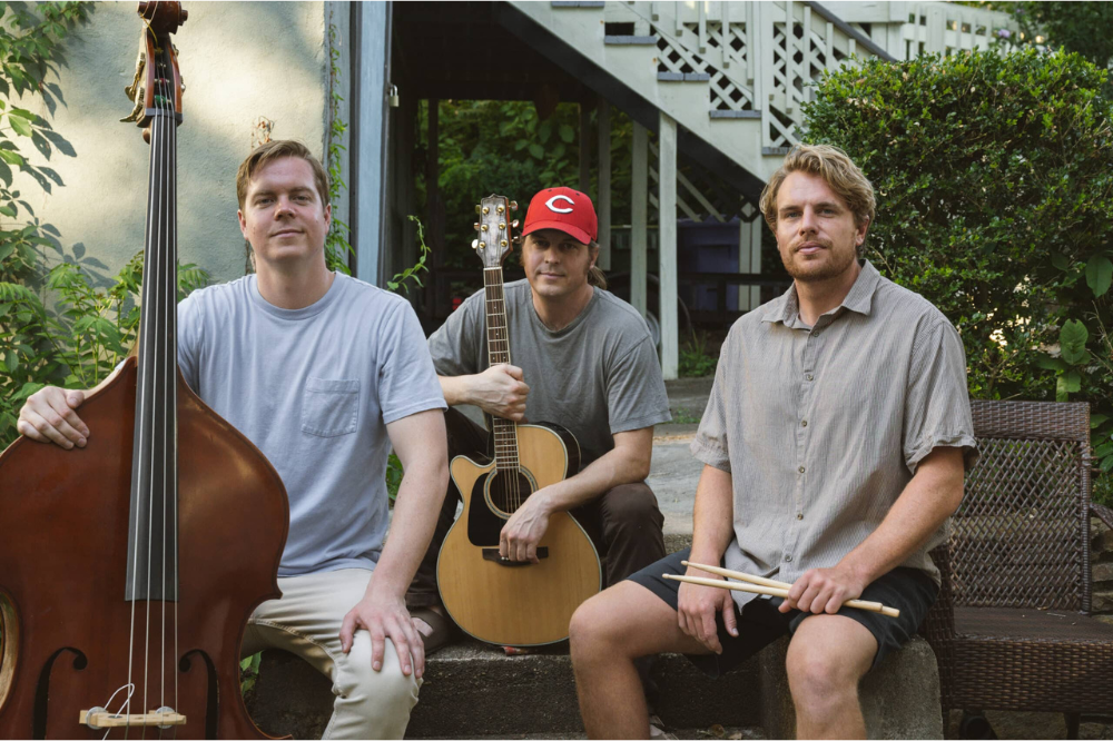 Photos of three men with instruments posing for The Hillclimbers band photo