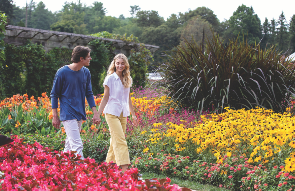 Couple walking in the summer gardens at Biltmore
