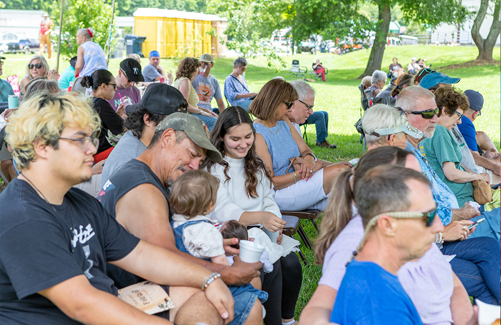 People of all ages listening and watching performances in Robbinsville NC