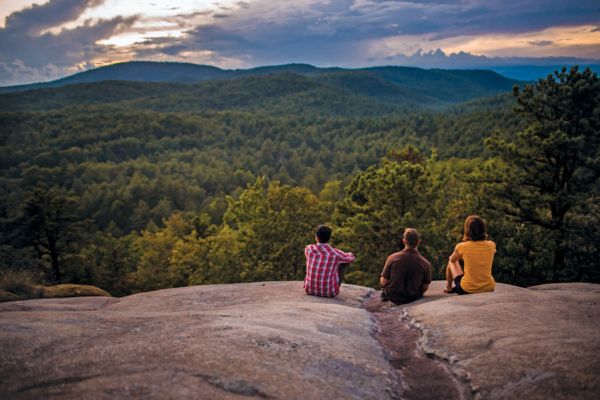 Hikers enjoy the view from John Rock in Brevard, NC.
