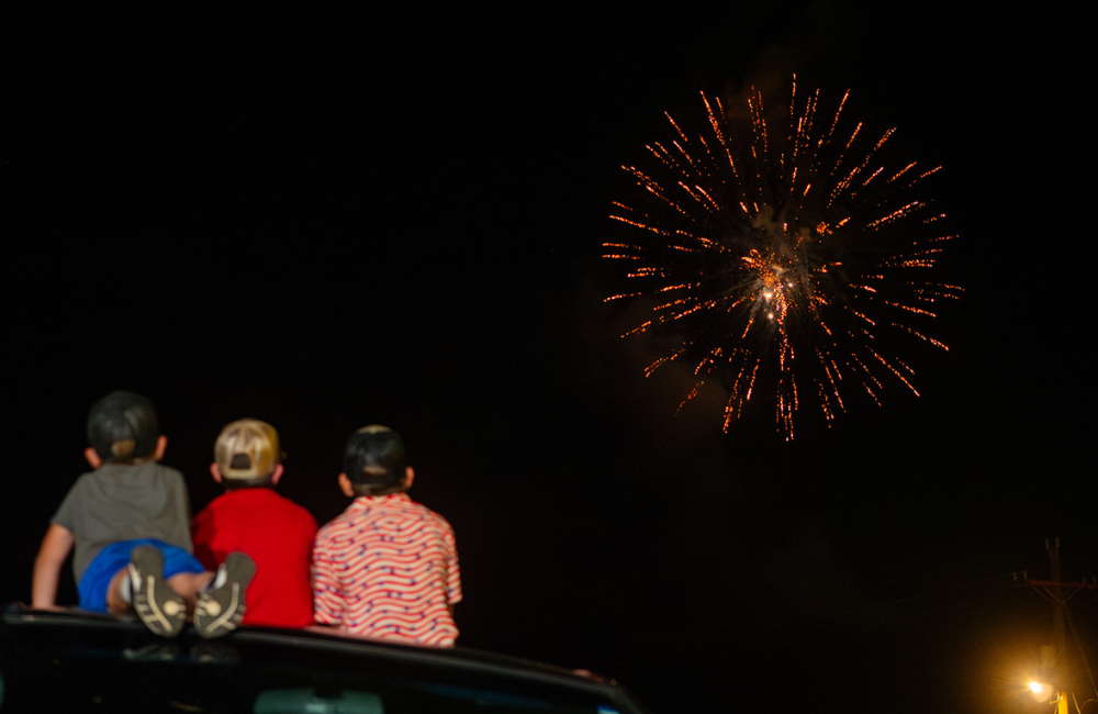 Kids watch fireworks in the dark skies in Bryson City, NC