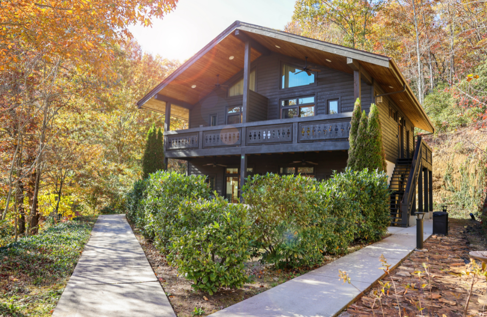 Alternative view of exterior of A private retreat with truly stunning views. The lodge and private suites are set on a dramatic rise just outside Great Smoky Mountains National Park and the Blue Ridge Parkway. From its lofty perch, you’re treated to an unobstructed view of the misty mountains and of Kuwohi, the highest point in the park.