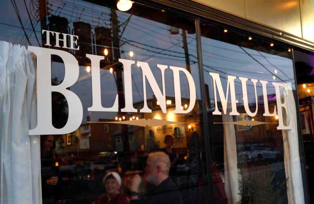 Front window of The Blind Mule restaurant in Brevard NC