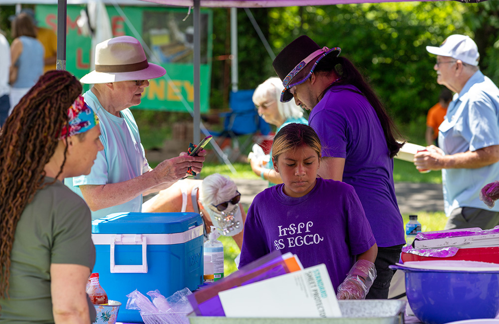 Cherokee people selling traditional frybread at the Flame Azalea Festival