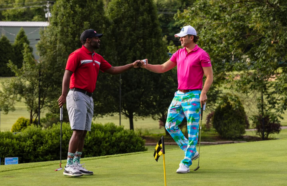 Two golfers shaking hands