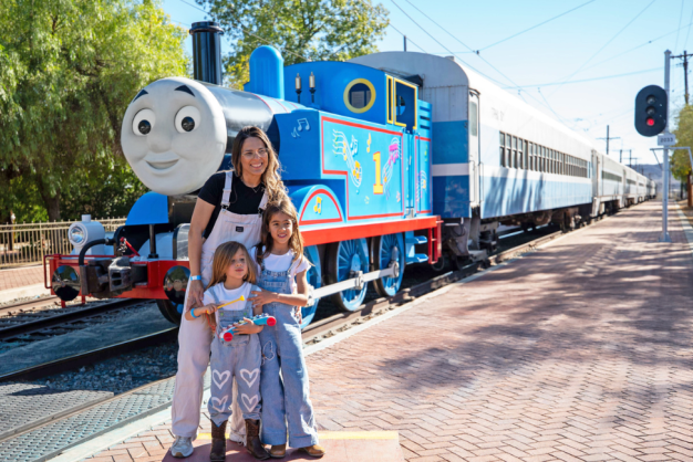 Day Out with Thomas™ in Whittier, NC Family posing in front of Thomas the Tank Engine